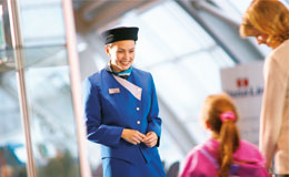 Picture of mother and daughter speaking to a stewardess